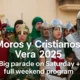 Participants in colorful Moorish and Christian costumes during Moros y Cristianos Vera 2025 parade in Vera, Almeria, Andalusia.