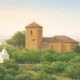 Calm illustrated landscape of Alsodux in the Andarax valley with terraced orchards, olive trees and a small historic church in inland Almeria