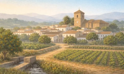 Illustrated view of Armuna de Almanzora in the Almanzora Valley with white village houses, farmland and a historic church in inland Almeria
