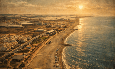 Quiet coastline of Balanegra in Almeria with beach and surrounding greenhouse landscape