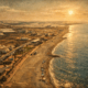 Quiet coastline of Balanegra in Almeria with beach and surrounding greenhouse landscape