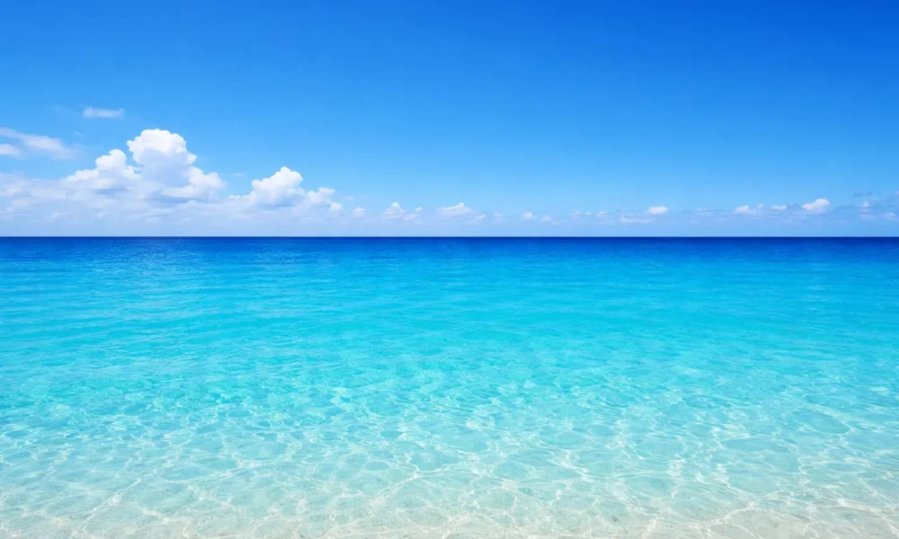 Coastal Almeria with calm blue sea, clear horizon and bright Mediterranean sky
