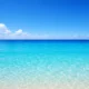 Coastal Almeria with calm blue sea, clear horizon and bright Mediterranean sky