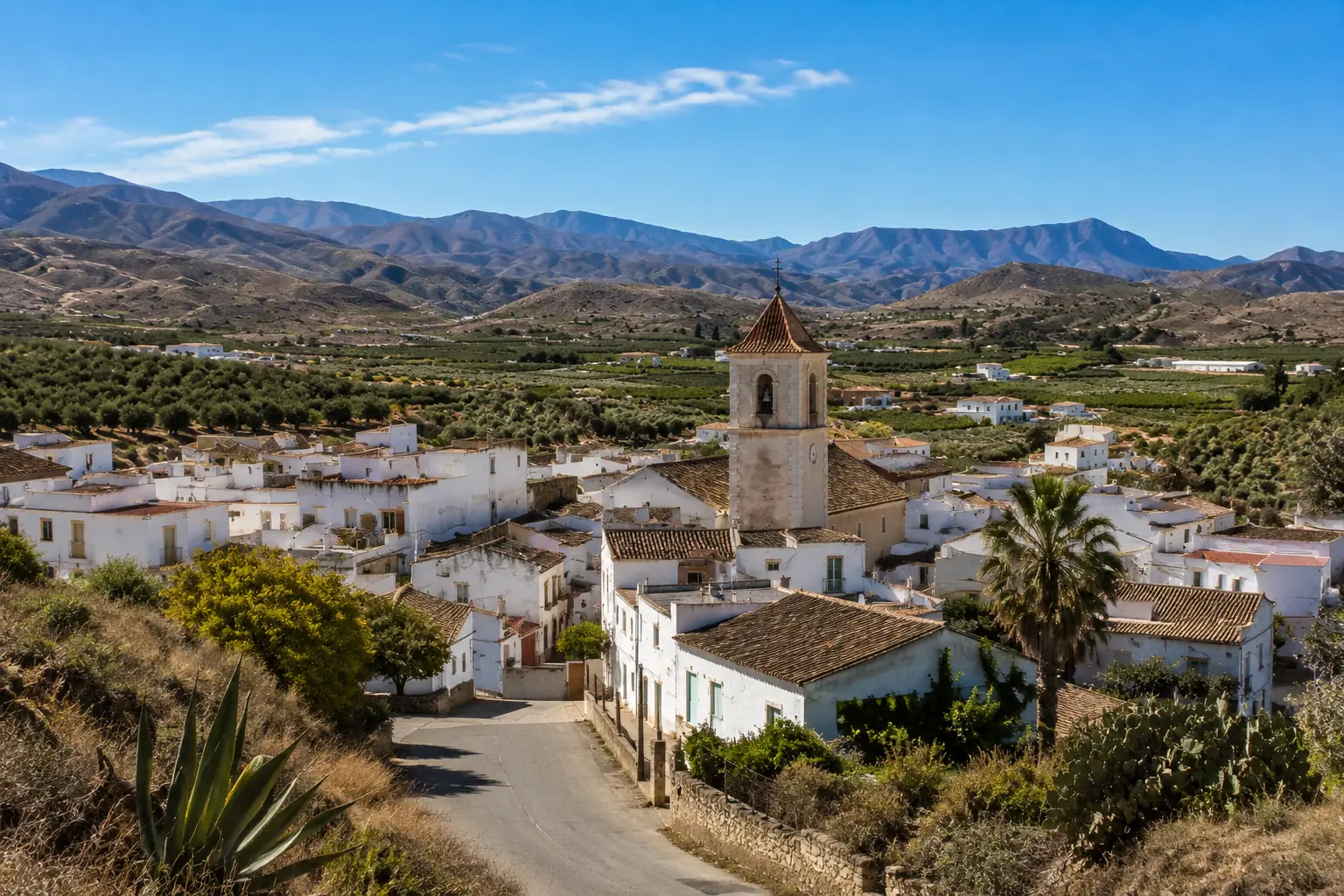 Traditional white village of Urracal in the Almanzora Valley surrounded by farmland and mountains in Almeria province