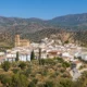 Panoramic view of Lubrín, a traditional white village in Almería, surrounded by olive groves, almond orchards and the rolling hills of the Sierra de los Filabres.