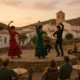 Flamenco dancers performing outdoors at dusk in Lucainena de las Torres during charity event