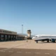 Almeria Airport with a UK airline jet ready for departure under clear Mediterranean skies.