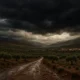 Storm clouds gather over Almeria's Almanzora Valley with rain-soaked hills and villages below.