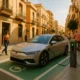 Electric vehicle charging station in Almería with green parking marks and city street scene