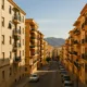 Sunlit apartment buildings on a residential street in Almeria city