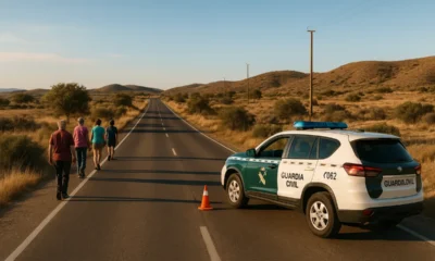 Pedestrians walking safely on rural Almeria road with Civil Guard patrol conducting checks