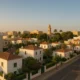 Ciudad Jardin neighborhood showing modern and traditional homes in soft Mediterranean sunlight.