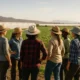 Women farmers gathered in an agricultural field near Almeria under natural Mediterranean light.