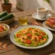 Zucchini spaghetti with shrimp and seasonal salad on a rustic table in Almeria