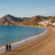 Almeria's Mediterranean coastline with beaches and hills under autumn sunlight