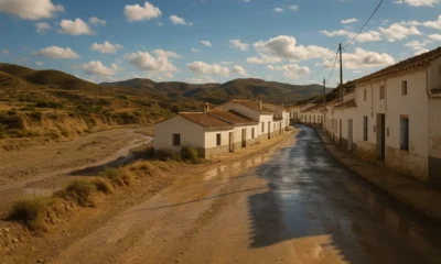 Almeria town with dry riverbed and recent rain under Mediterranean light.