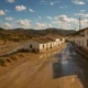 Almeria town with dry riverbed and recent rain under Mediterranean light.