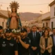 Religious procession in El Ejido for Divina Infantita centennial, police carrying statue at dusk