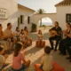 Families clapping and enjoying live flamenco music at Aula del Mar, Roquetas de Mar