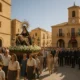 Procession celebrating Virgen de las Angustias centennial in Vera’s Plaza Mayor under Mediterranean light